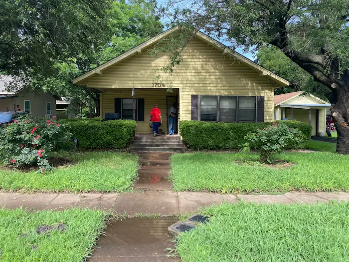 Older rental home in Sherman Texas being evaluated by a cash buyer from Hippie Home Buyers in Grayson County