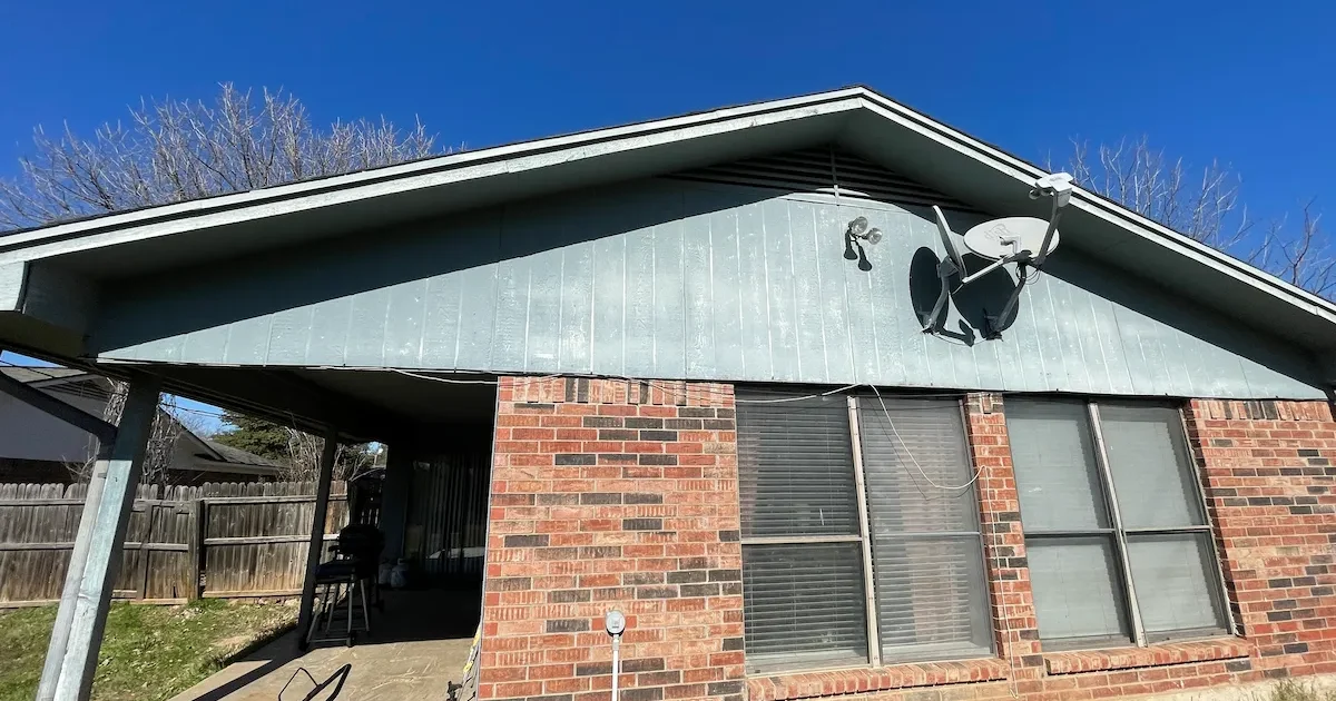 Older brick home in Grayson County Texas with deferred maintenance representative of inherited properties we buy for cash